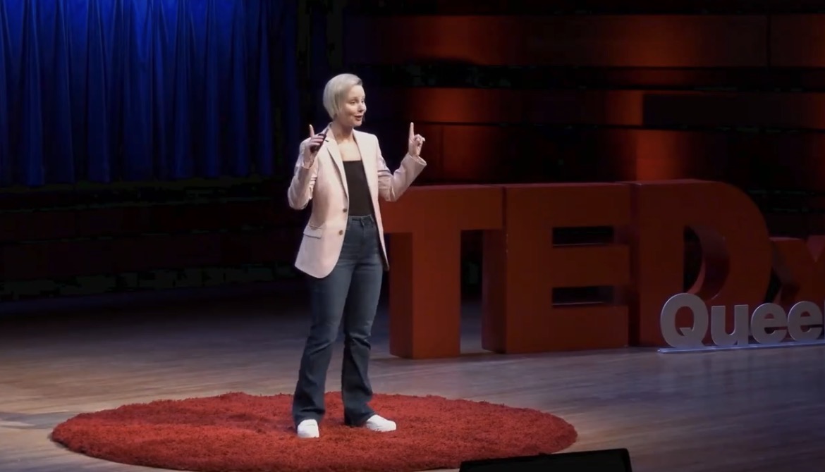 Lindsy Matthews on the TEDx stage at Queens University.